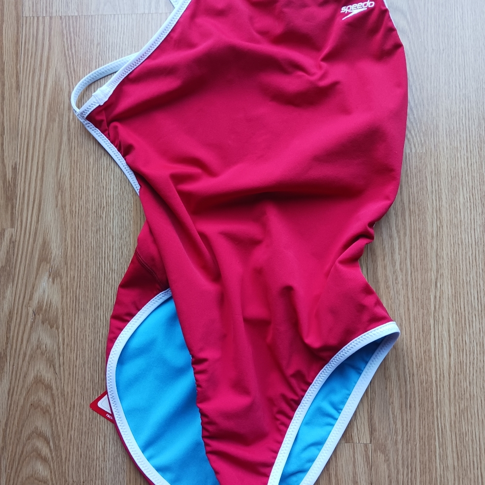 Ladies NWT Speedo swimsuit. Racing type, size 12/38. Red/blue reversible.